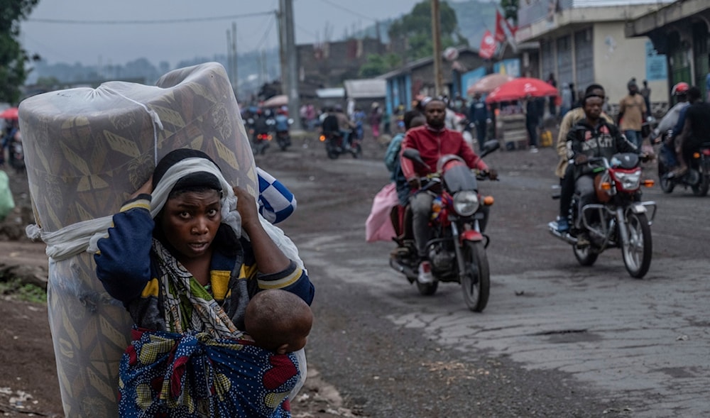 People displaced by the fighting with M23 rebels make their way to the center of Goma, Democratic Republic of the Congo, Sunday, Jan. 26, 2025. (AP)