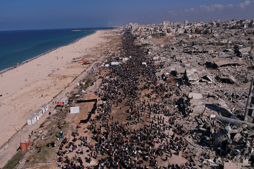 Displaced Palestinians return to their homes in the northern Gaza Strip on Monday, January 27, 2025 (AP)