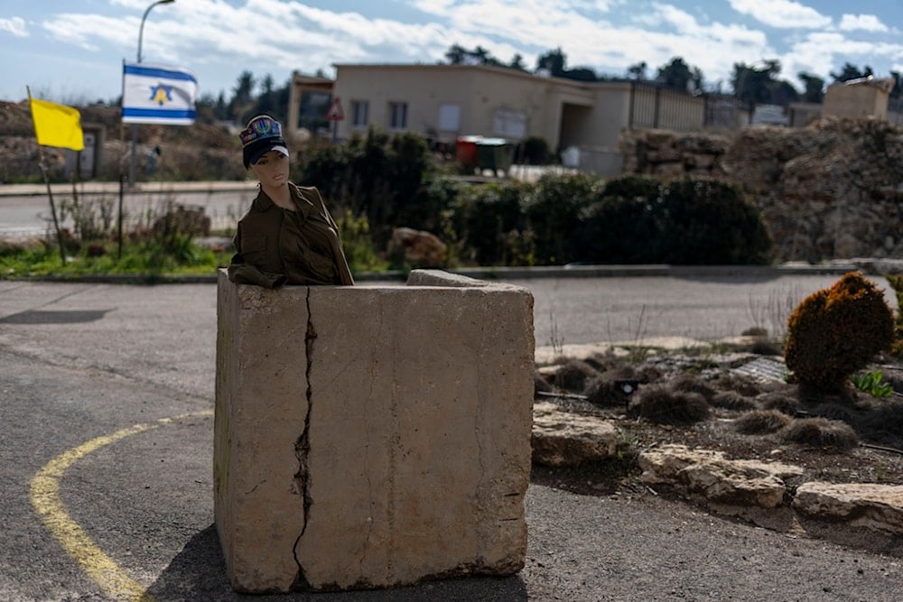 A mannequin with military clothing used as a decoy stands in the Kibbutz Manara, northern Palestine, on the border with Lebanon, Jan. 5, 2025. (AP Photo/Ariel Schalit)