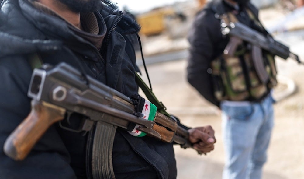 Members of the new Syrian security forces stand outside a security building, in Nawa, near Daraa, Syria, Jan. 4, 2025. (AP)