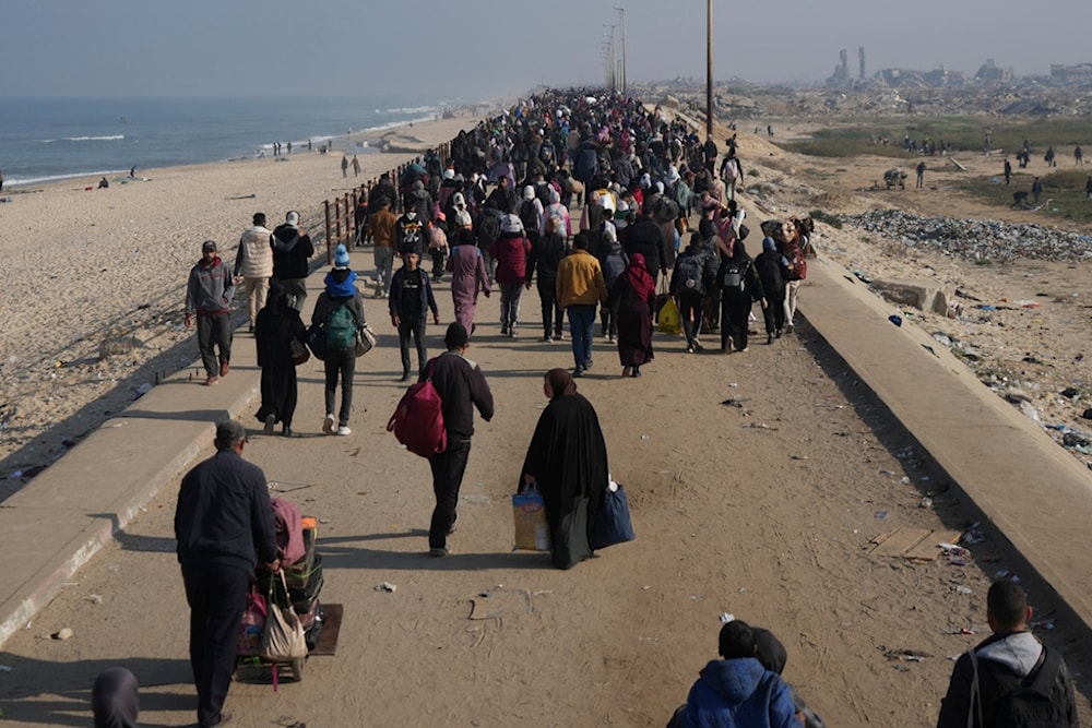 Displaced Palestinians walk on a road to return to their homes in the northern Gaza Strip, Tuesday, Jan. 28, 2025. (AP)