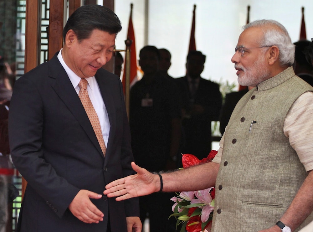  In this Sept. 17, 2014, file photo, Indian Prime Minister Narendra Modi, right, welcomes Chinese President Xi Jinping, upon his arrival at a hotel in Ahmadabad, India. (AP)