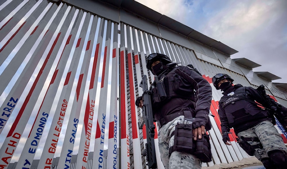 Members of the Mexican National Guard patrol next to the US-Mexico border wall Saturday, Jan. 25, 2025, in Tijuana, Mexico. (AP)