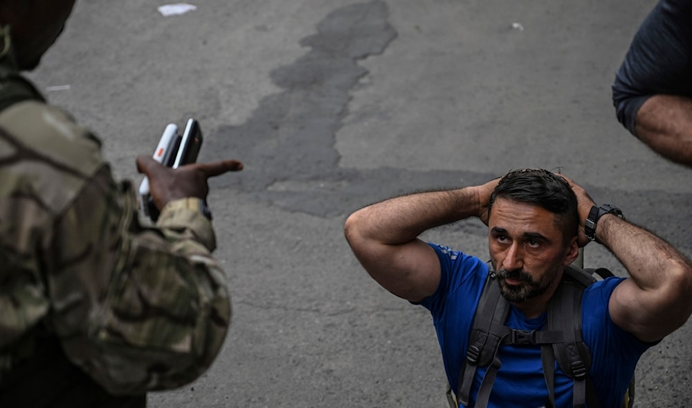 M23 rebels escort Romanian mercenaries to the border crossing into Rwanda in Goma, Democratic Republic of Congo, Wednesday, Jan. 29, 2025.(AP)