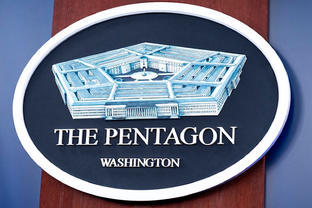 The Department of Defense logo is seen on the wall in the Press Briefing room at the Pentagon on Tuesday, Oct. 29, 2024 in Washington. (AP Photo/Kevin Wolf)