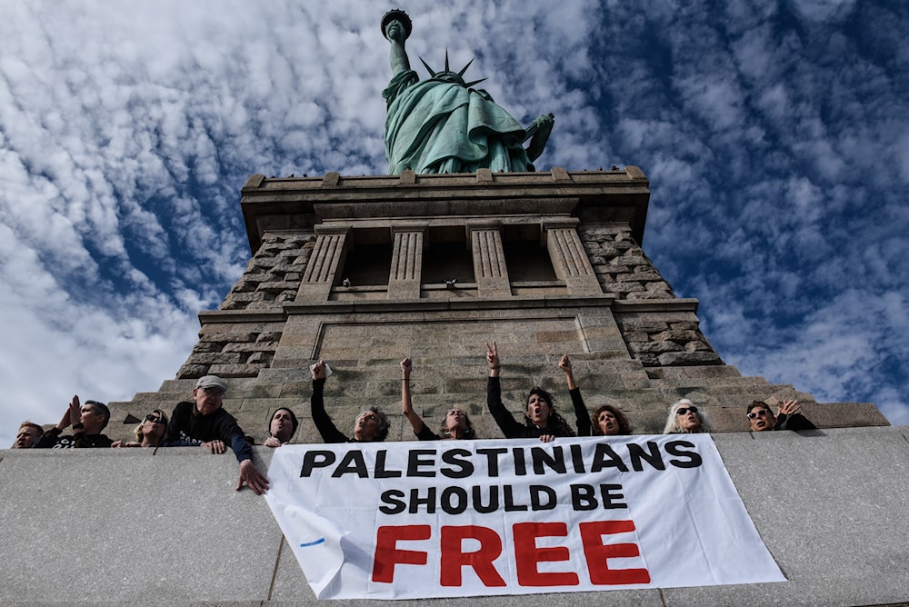 Activists from Jewish Voice for Peace occupy the pedestal of the Statute of Liberty. (Getty Images via AFP)