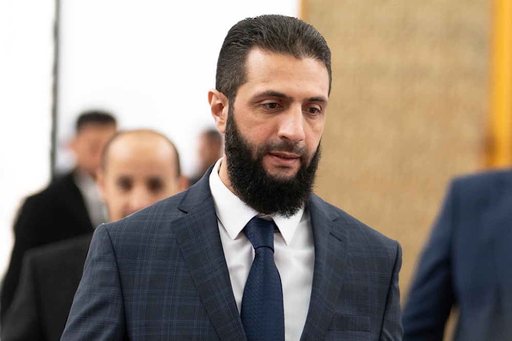 Syrian transitional president Ahmad al-Sharaa, walks in the presidential palace in Damascus, Saturday, Dec. 28, 2024 (AP)