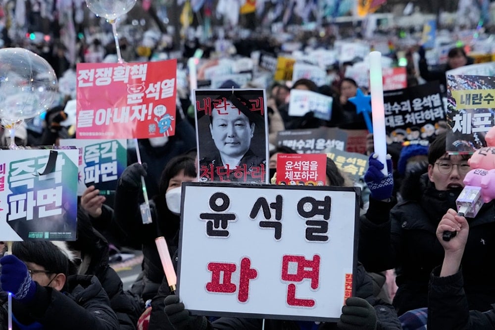 Protesters attend a rally demanding the arrest of impeached South Korean President Yoon Suk Yeol in Seoul, South Korea, Saturday, January 4, 2025 (AP)