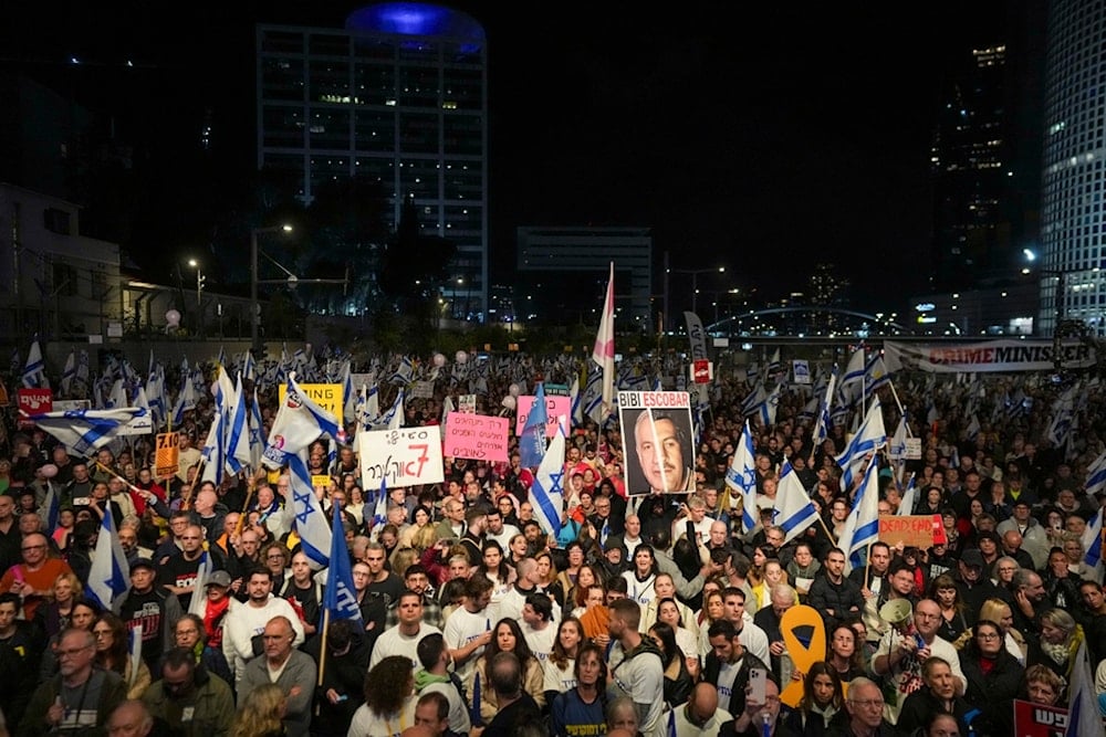 Israelis protest against Prime Minister Benjamin Netanyahu's government and call for the release of captives held in the Gaza Strip by Hamas in Tel Aviv, occupied Palestine, Saturday, December 21, 2024 (AP)