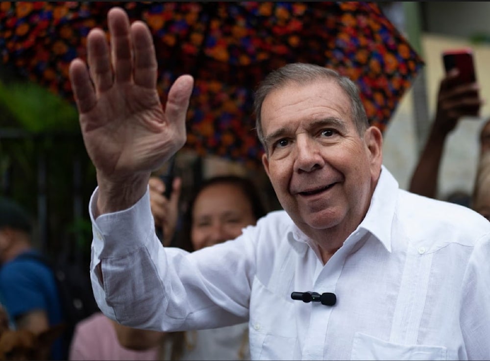 The Venezuela opposition presidential candidate, Edmundo Gonzalez, waves to supporters during a political event in June. (AP)