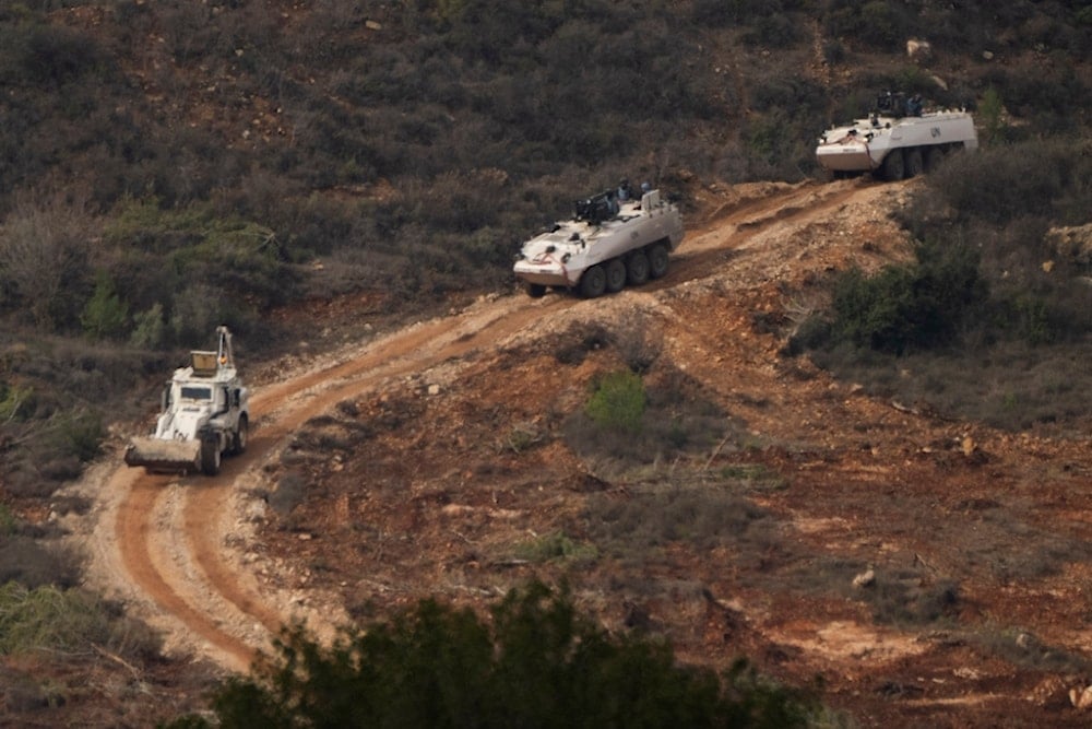 A convoy of armored vehicles of the United Nations peacekeeping forces in Lebanon (UNIFIL) drives on the area along the Palestinian-Lebanese border as seen from northern occupied Palestine, Friday, November 29, 2024 (AP)