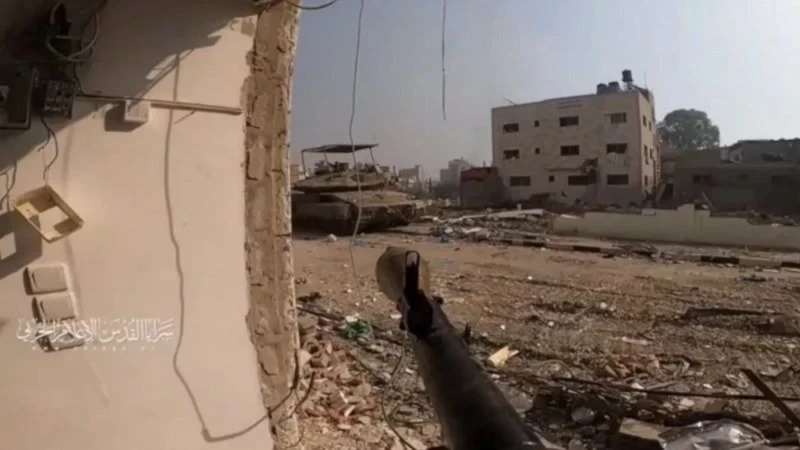 An al-Quds Brigades fighter engages an Israeli military vehicle at point-blank range in an undisclosed location in the Gaza Strip, occupied Palestine (Al-Quds Brigades military media)