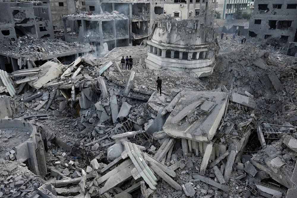 Palestinians inspect the rubble of the Yassin Mosque destroyed after it was hit by an Israeli airstrike at Shati refugee camp in Gaza City, on Oct. 9, 2023. (AP Photo/Adel Hana, File)