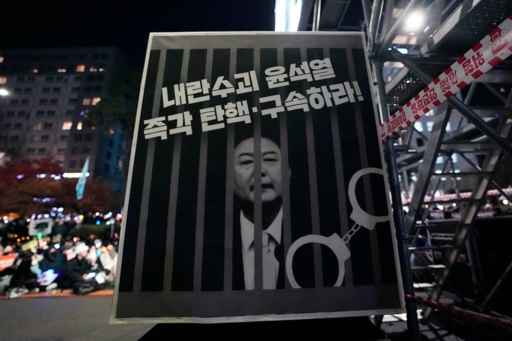 An image depicting an imprisoned South Korean President Yoon Suk Yeol is displayed during a rally to demand his impeachment outside the National Assembly in Seoul, South Korea, on December 13, 2024. (AP)