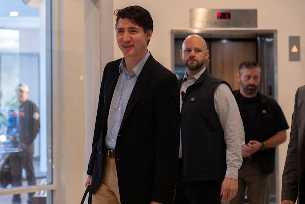 Canada Prime Minister Justin Trudeau walks through the lobby of the Delta Hotel by Marriott, Saturday, November 30, 2024, in West Palm Beach, Florida (AP)