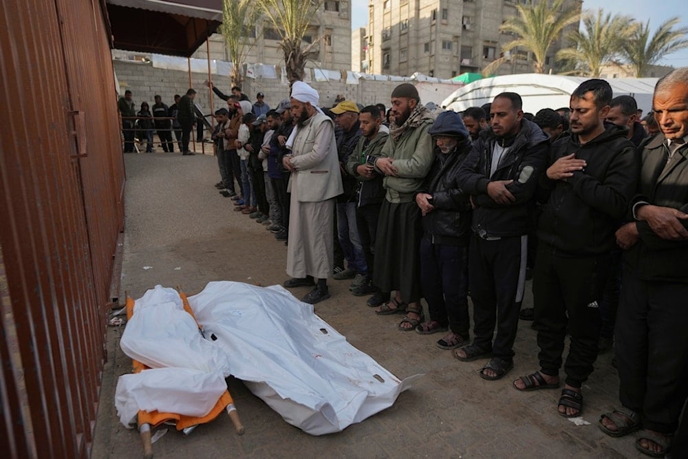 Palestinians attend funeral prayers for two of the ten people killed in overnight Israeli airstrikes on the Khan Younis refugee camp, southern Gaza Strip, Saturday, Jan. 4, 2025 (AP)