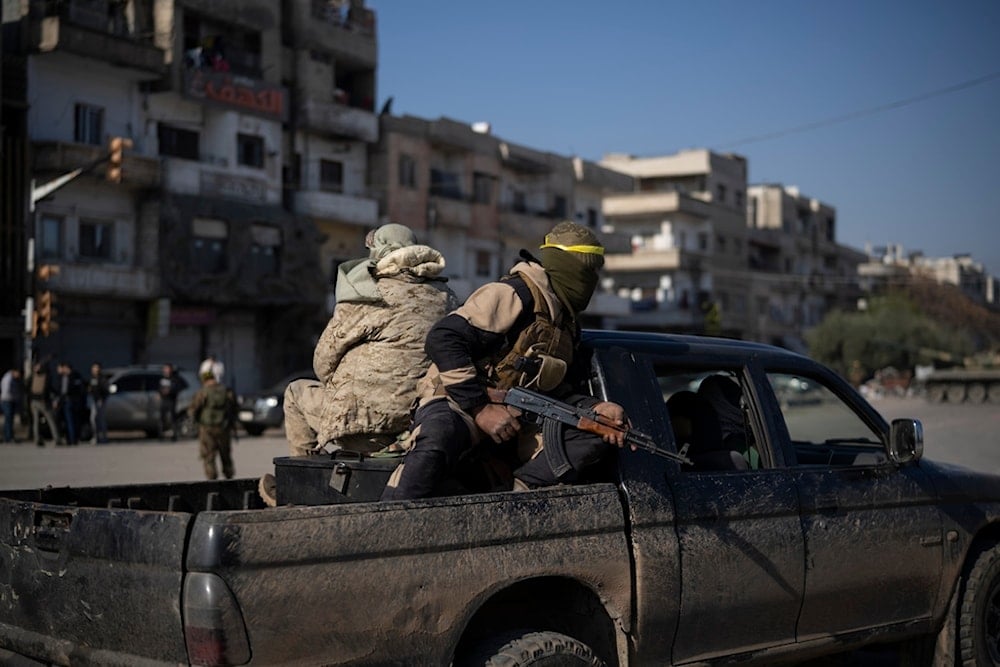 Members of the new security forces take part in an operation to detain men suspected of being part of militias or Syrian Arab Army soldiers in Homs, Syria, Friday, January 3, 2025 (AP)