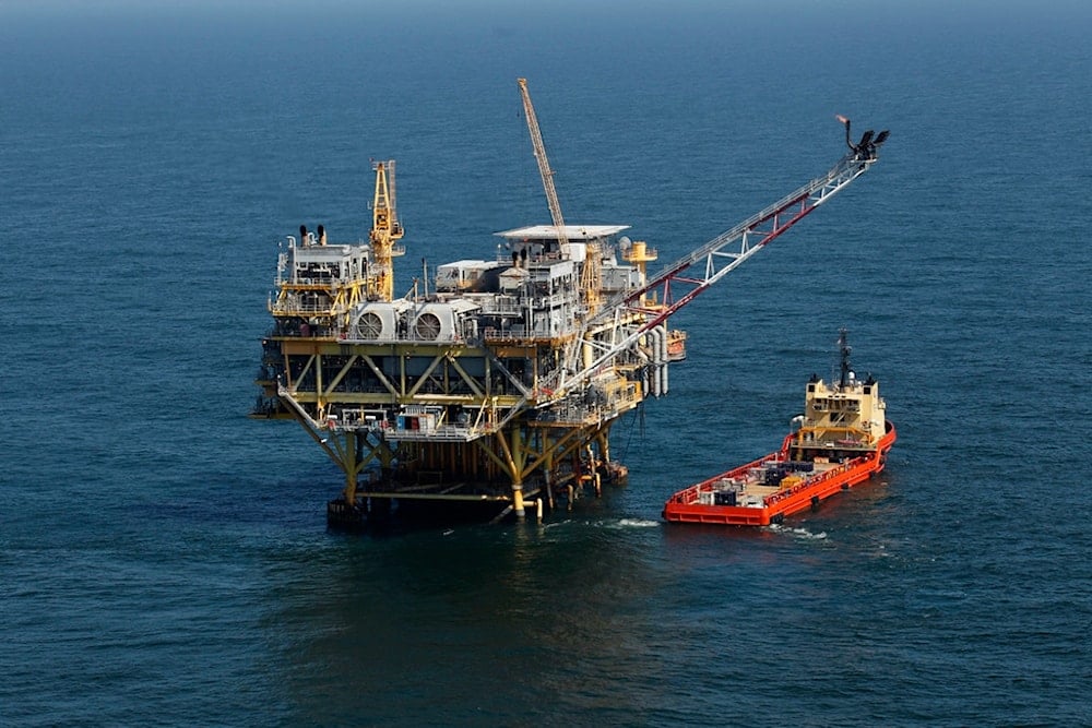 This April 10, 2011, file photo, shows a rig and supply vessel in the Gulf of Mexico, off the coast of Louisiana. (AP)