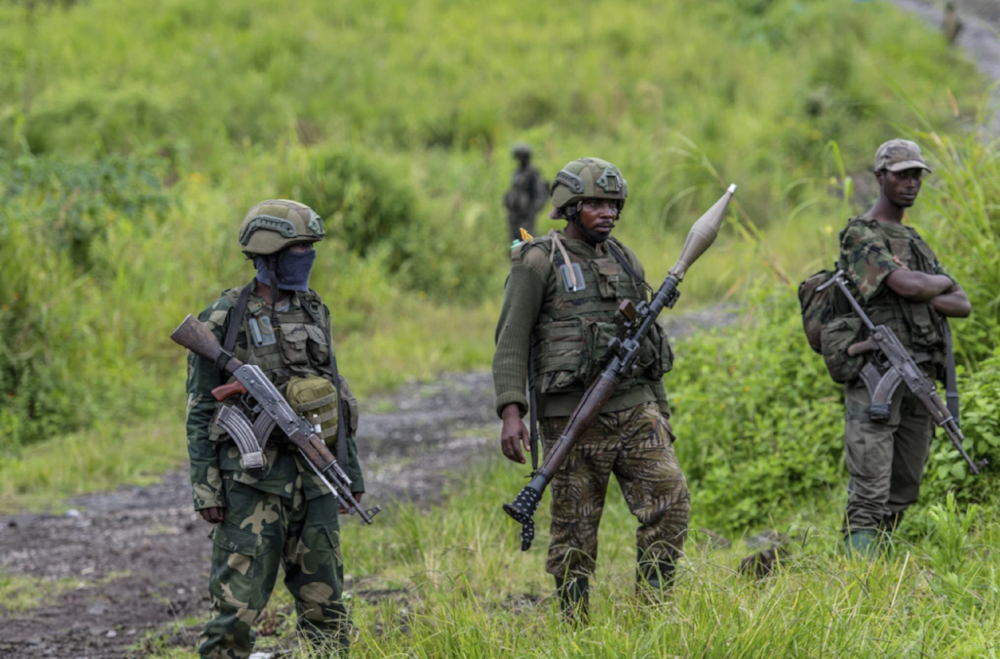 M23 rebels stand with their weapons in Kibumba in the eastern of Democratic of Congo on December 23, 2022. (AP)