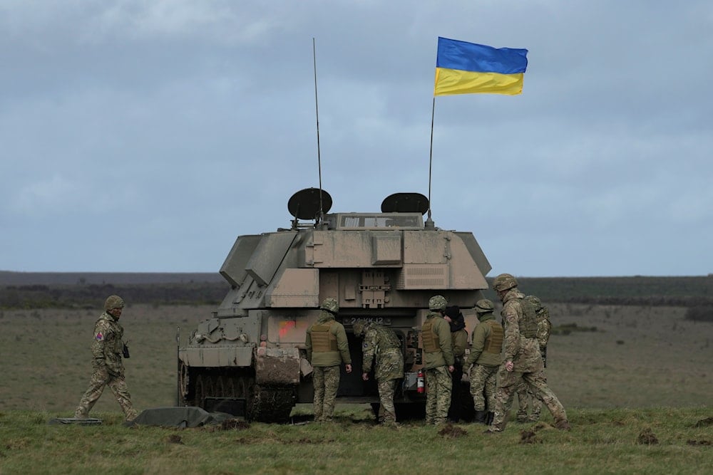 Ukrainian soldiers take part in a military exercise at a military training camp in an undisclosed location in England, on March 24, 2023. (AP)