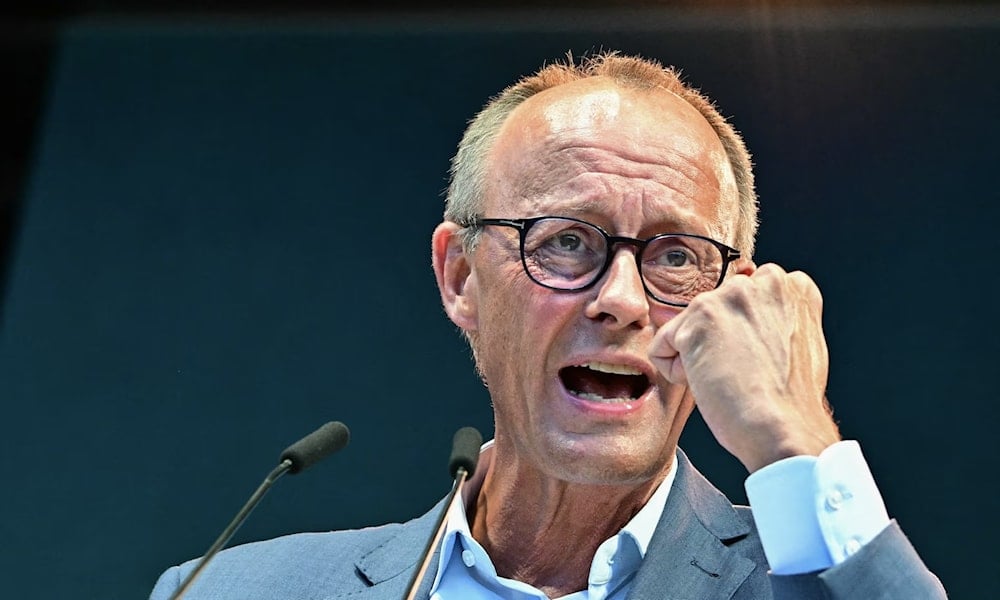 Friedrich Merz addresses the audience during a campaign event for Brandenburg's regional state elections on 4 September. (AFP/Getty Images)