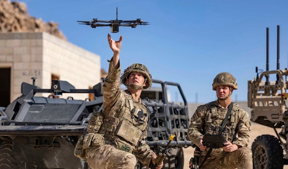 In this photo from the Defense Visual Information Distribution Service, British soldiers launch a drone during Project Convergence exercises at Fort Irwin, Calif., on Nov. 4, 2022. (AP)