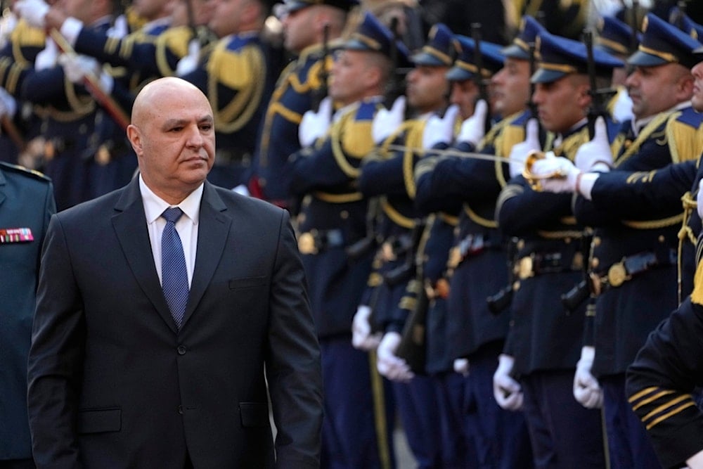 Newly-elected Lebanese President Joseph Aoun reviews the honor guard upon his arrival at the Lebanese Parliament to be sworn in as a new president, in Beirut, Lebanon, Thursday, Jan. 9, 2025 (AP)