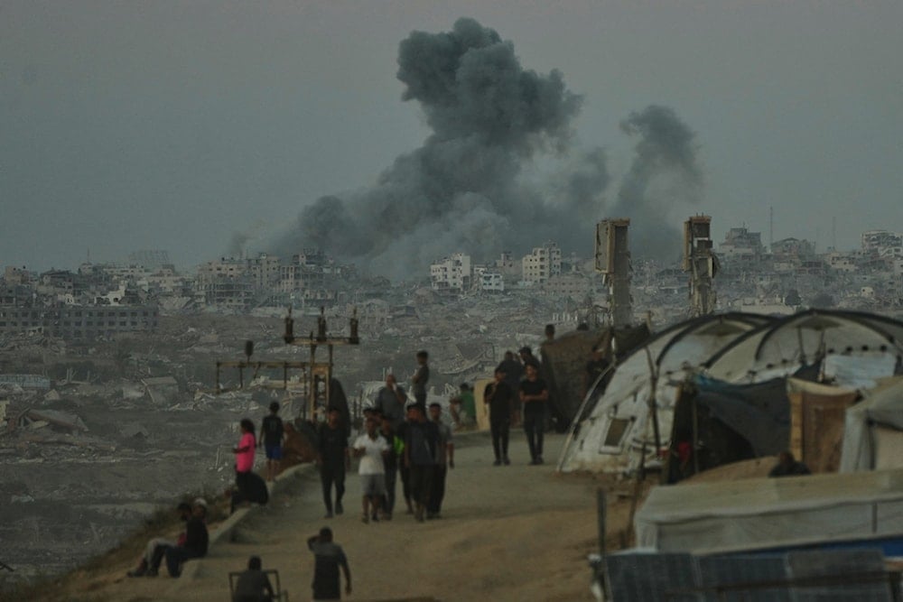 Smoke rises following an Israeli military strike in Gaza City, as seen from the central Gaza Strip, Wednesday, October 1, 2025. (AP Photo/Jehad Alshrafi)