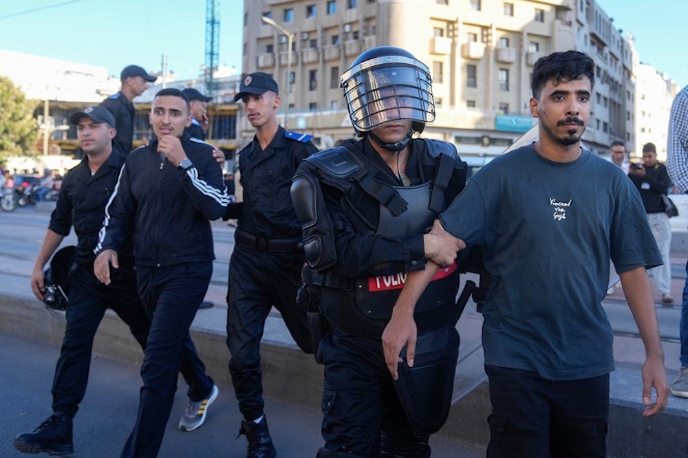 People are detained while taking part in a youth-led protest calling for education and health reforms, in Casablanca, Morocco, Monday, Sept. 29, 2025 (AP)