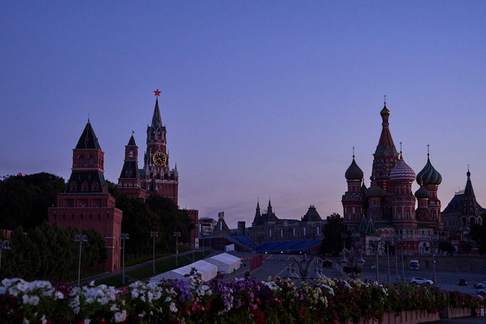 The Kremlin Wall, the Spasskaya Tower, second left, empty Red Square and St. Basil's Cathedral are seen in an early morning prior to sunrise in Moscow, Russia, on Saturday, August 16, 2025. (AP Photo/Alexander Zemlianichenko)