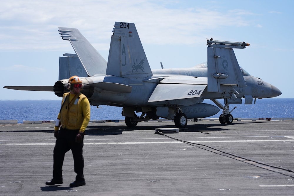 An F-16 Hornet is parked on the flight deck of the nuclear powered aircraft carrier USS Gerald R. Ford during military exercises in the Mediterranean off the coast of Naples, Italy, Tuesday, July 29, 2025 (AP)
