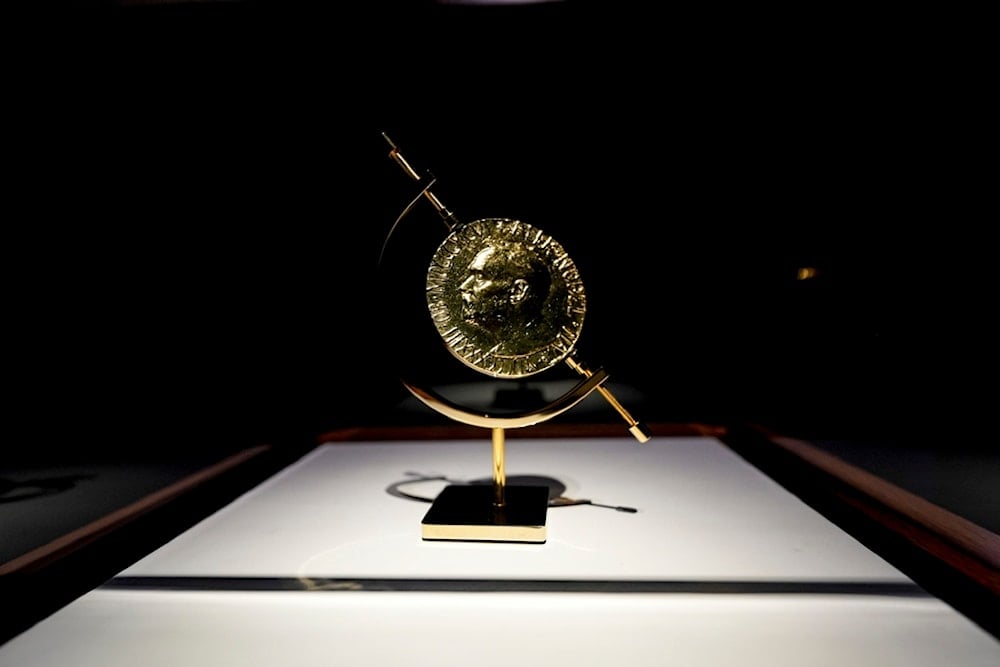 Former President Jimmy Carter's 2002 Nobel Peace Prize is sen on display at the Jimmy Carter National Historical Park, Monday, December 30, 2024, in Plains, Ga. (AP Photo/Mike Stewart)