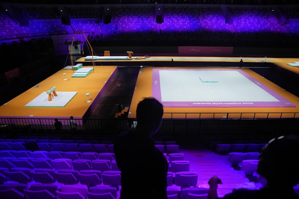 Workers are seen at the venue prepared for the Artistic Gymnastics World Championships at Indonesia Arena in Jakarta, Indonesia, on October 10, 2025. (AP Photo/Dita Alangkara)