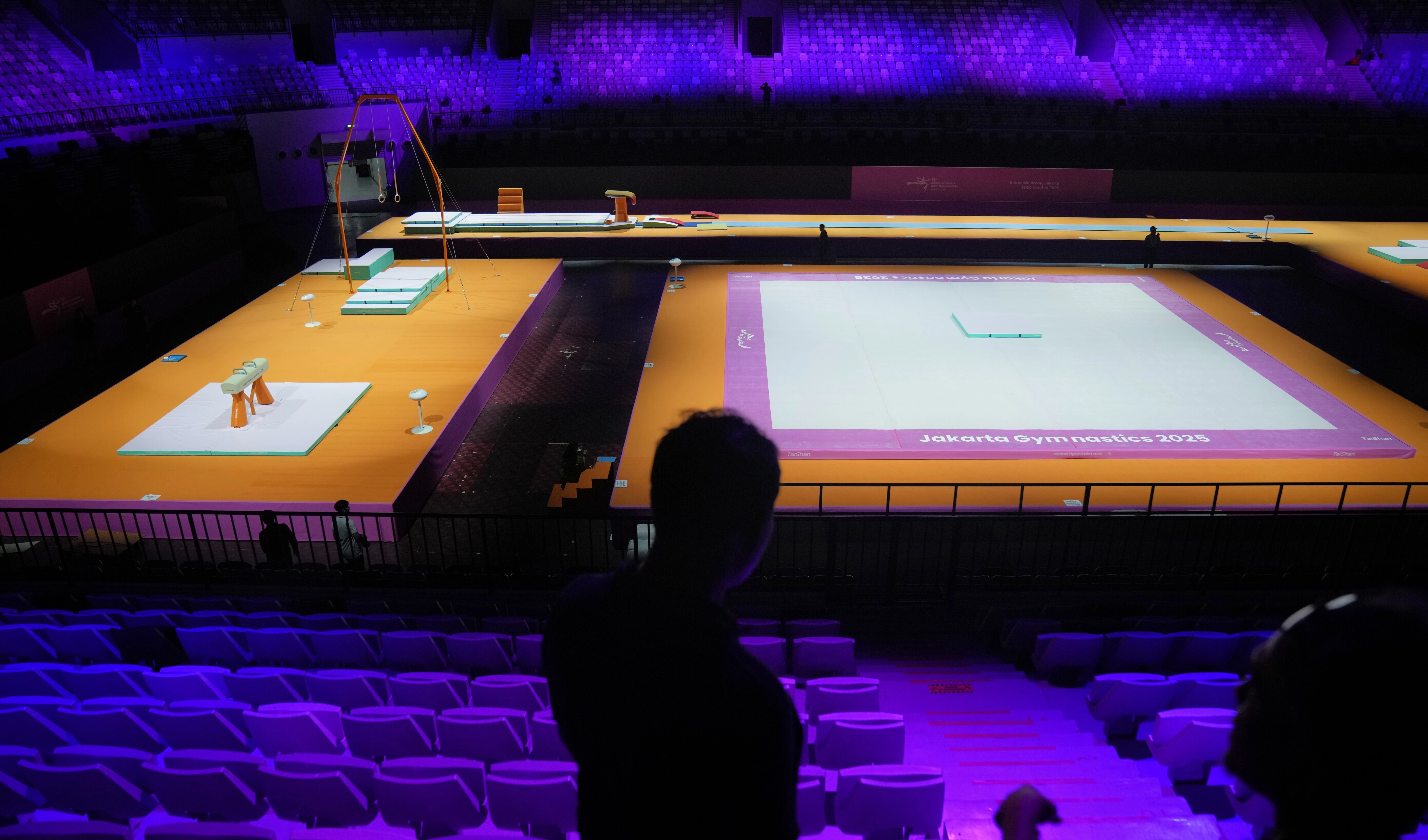 Workers are seen at the venue prepared for the Artistic Gymnastics World Championships at Indonesia Arena in Jakarta, Indonesia, on October 10, 2025. (AP Photo/Dita Alangkara)