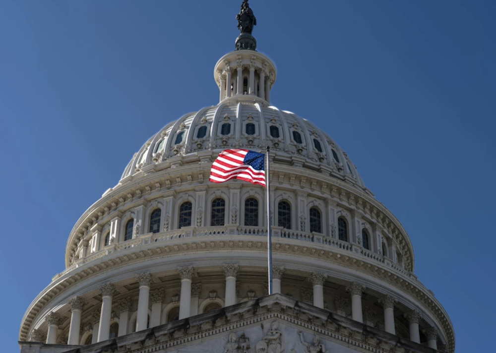 The American flag waves over the Capitol in Washington on the ninth day of the government shutdown on October 9, 2025. (AP)