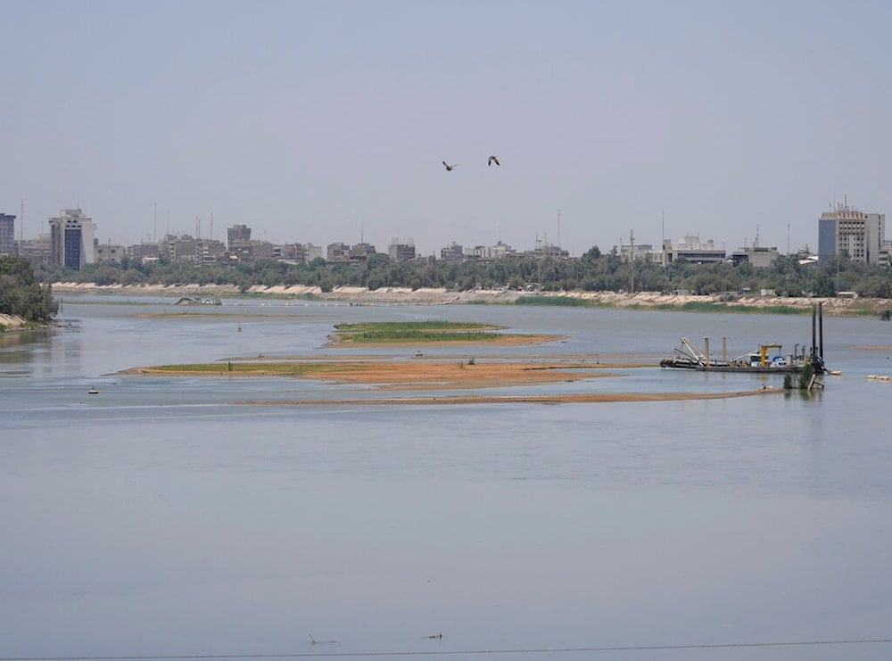 Significantly lower water levels are seen on the Tigris River, in Baghdad, Iraq, Saturday, May 28, 2022. (AP Photo/Hadi Mizban)