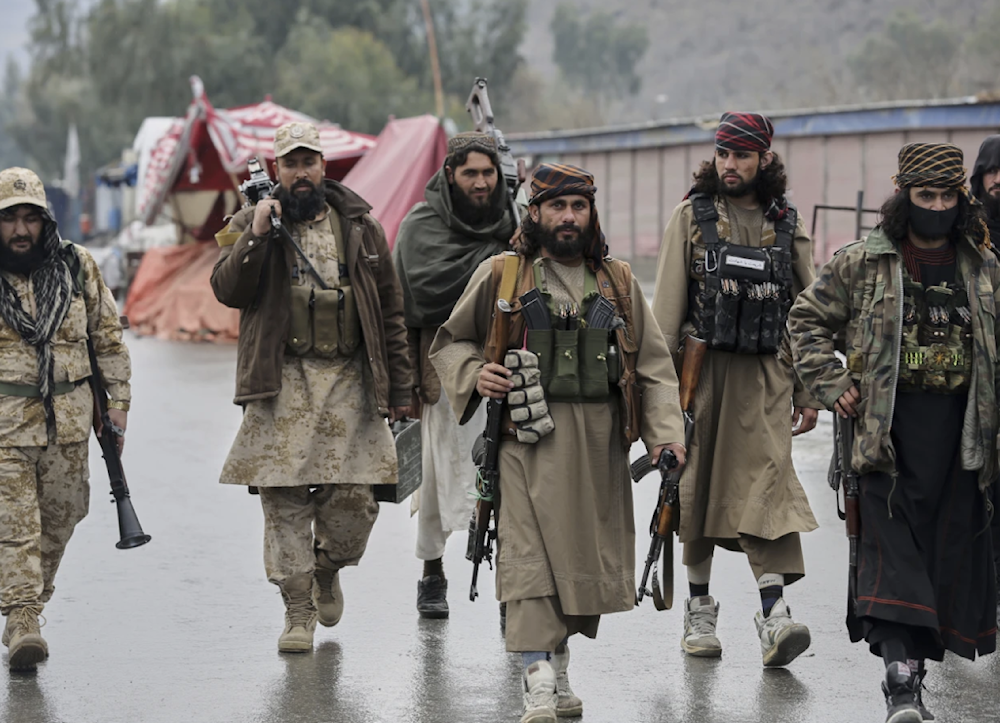 Taliban fighters patrol near the closed Torkham border with Pakistan where Pakistani and Afghan forces exchanged fire overnight in Torkham, Afghanistan on March 3, 2025. (AP)