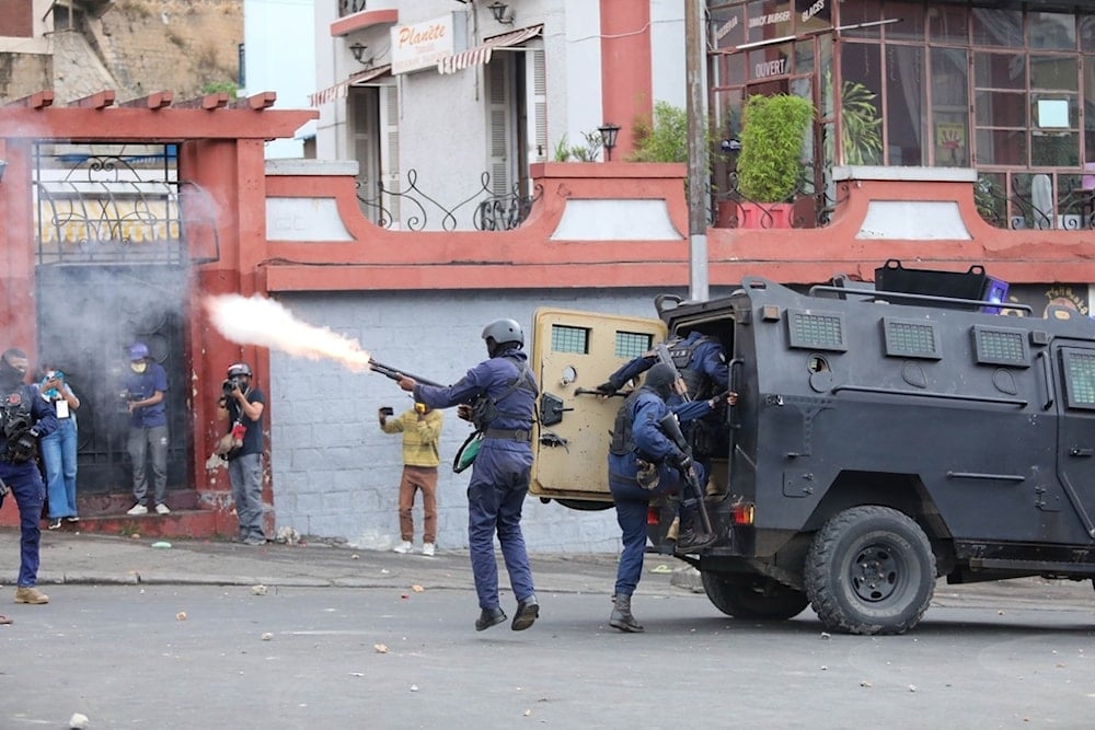 Madagascar police react to protesters demonstrating against chronic electricity and water cuts in Antananarivo, Madagascar, Tuesday, September. 30, 2025. (AP Photo/Mamyrael)