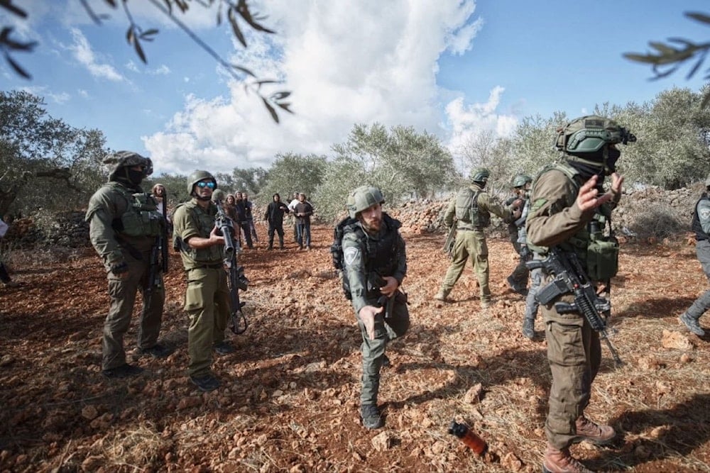 Israeli troops cover settlers as they vandalize olive tree fields in Beita, Nablus, Occupied Palestine, October 10. 2025 (social media)