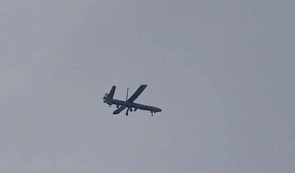An Israeli drone flies over Tyre city, south Lebanon, Thursday, Nov. 21, 2024. (AP Photo/Hussein Malla)