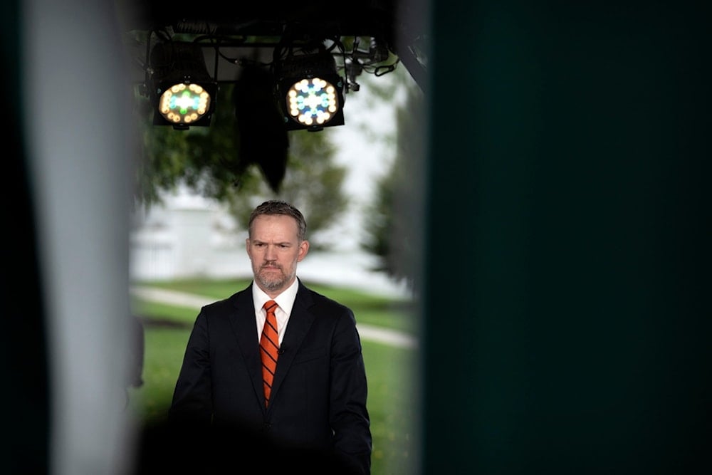 US Trade Representative Jamieson Greer listens during a television interview at the White House, Friday, August 1, 2025, in Washington. (AP Photo/Mark Schiefelbein)