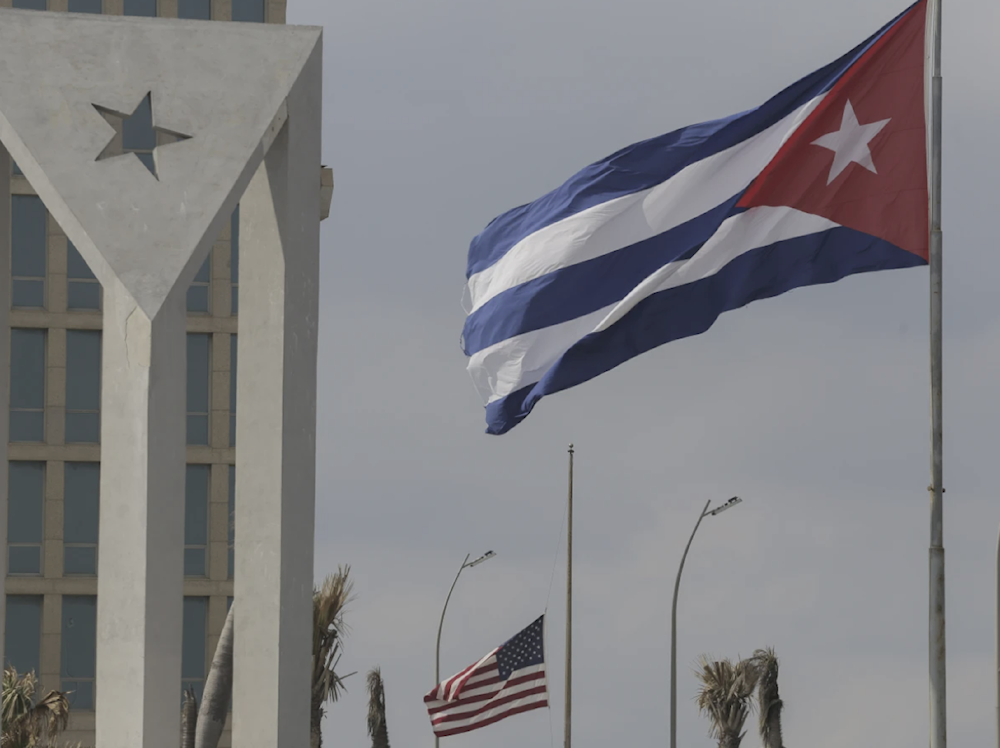Cuban and American flags fly in the wind outside the American embassy in Havana, Cuba on January 14, 2025. (AP)