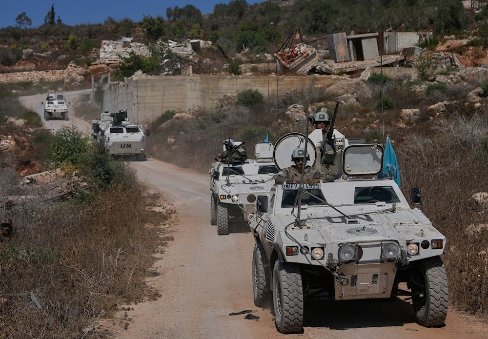 French U.N. peacekeepers patrol along the Lebanese-Israeli border in Kfra Kila village, south Lebanon, on August 20, 2025. (AP Photo/Hussein Malla)