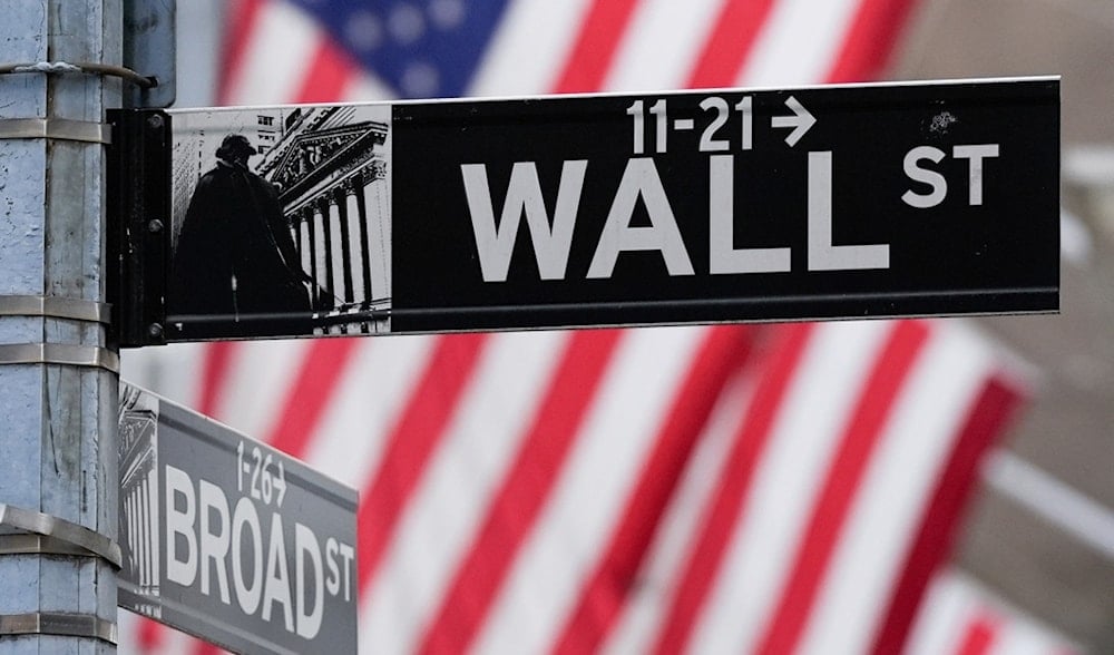 A sign outside the New York Stock Exchange marks the intersection of Wall and Broad Streets, Jan. 28, 2025, in New York. (AP)