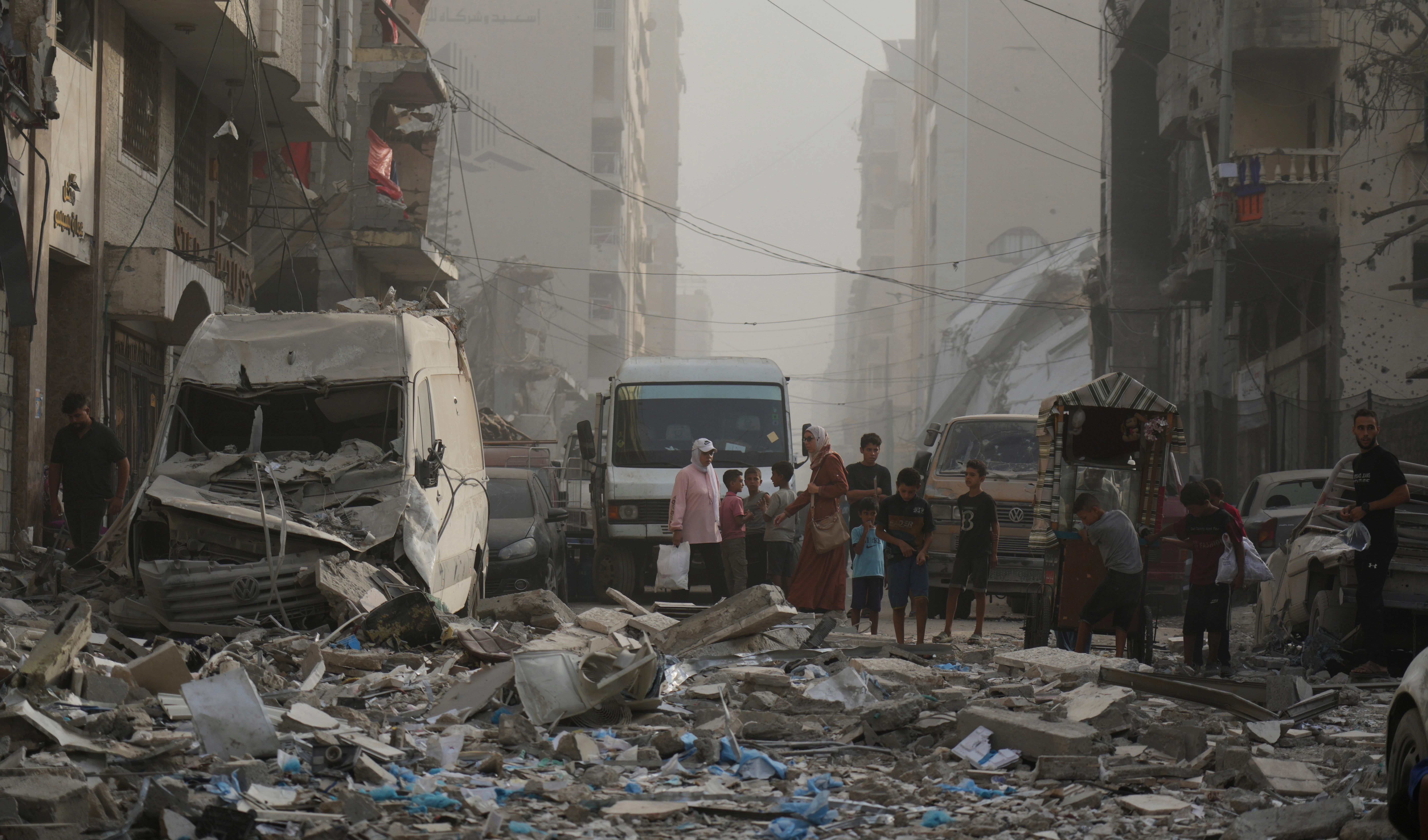 Palestinians stand next to a heavily damaged building in the Rimal neighborhood, in Gaza City, Sunday, Aug. 31, 2025, a day after it was hit by an Israeli military strike that killed several people. (AP Photo/Jehad Alshrafi) Palestinians stand next to a heavily damaged building in the Rimal neighborhood, in Gaza City, Sunday, Aug. 31, 2025, a day after it was hit by an Israeli military strike that killed several people. (AP Photo/Jehad Alshrafi)
