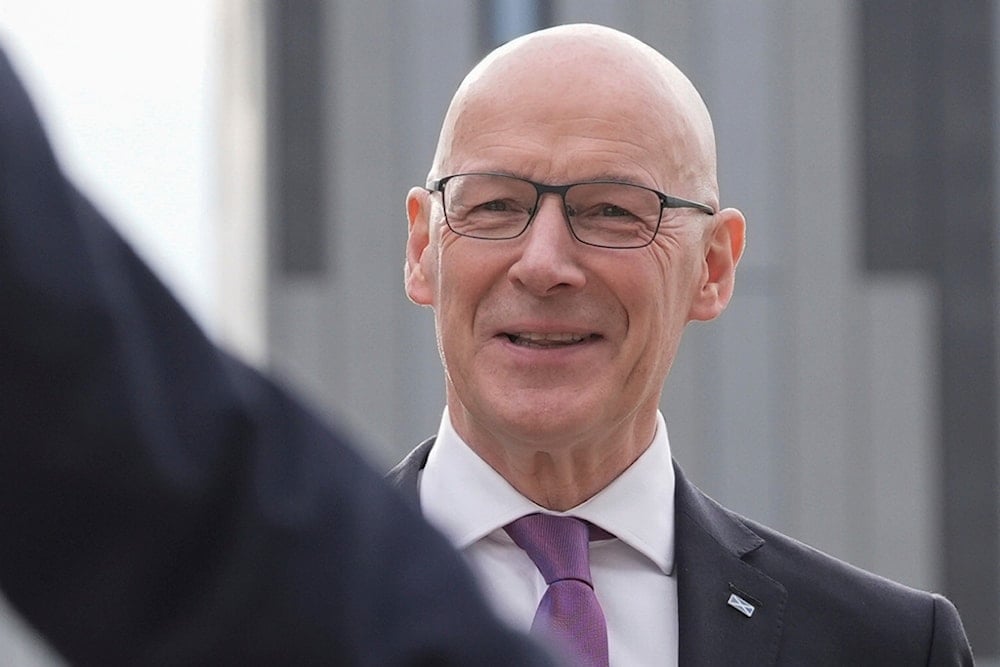 Scottish First Minister and Scottish National Party leader John Swinney arrives at York University, York, England, on June 20, 2024 (AP)