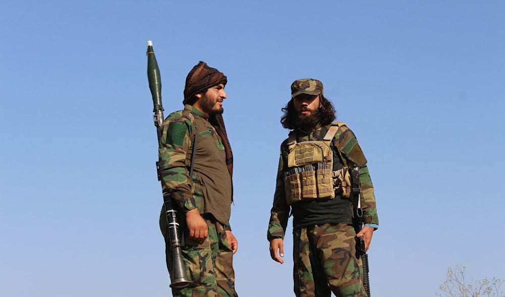 Afghan servicemen guard along the border in the Zazai Maidan district of Khost province, Afghanistan, Oct. 12, 2025, after overnight clashes with Pakistan's forces. (AP)
