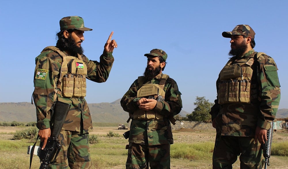 Afghan servicemen guard along the border in the Zazai Maidan district of Khost province, Afghanistan, Sunday, Oct. 12, 2025. (AP)