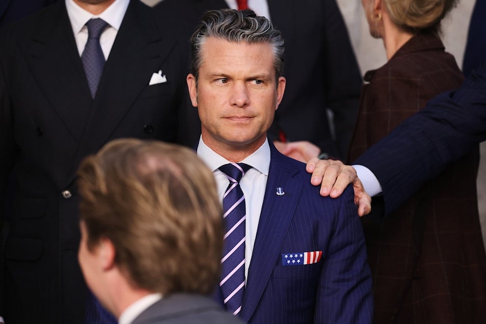 Italy's Defense Minister Guido Crosetto puts his hand on the shoulder of United States Defense Secretary Pete Hegseth during a group photo of NATO defense ministers at NATO headquarters in Brussels, Wednesday, Oct. 15, 2025 (AP)