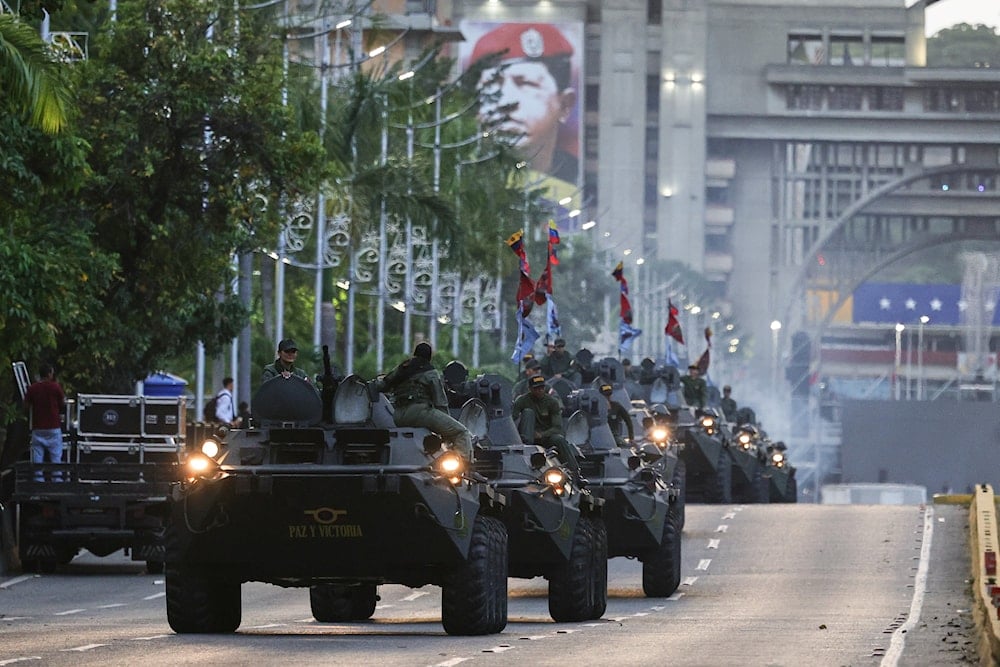 Armored vehicles drive through a street during a government-organized march in support of President Nicolas Maduro in Caracas, Venezuela, Tuesday, Sept. 23, 2025 (AP)